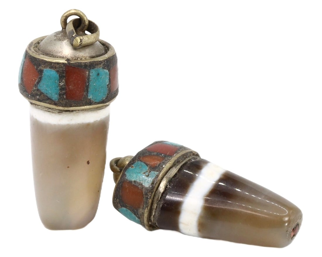 Lot of 2 Vintage Mid-Century Tibetan Agate Locket Amulets, c. 1950s: These distinctive Tibetan agate locket amulets from the 1950s exhibit the rich cultural craftsmanship of the region. Made of agate with intricate inlaid patterns of turquoise and coral, these pieces r