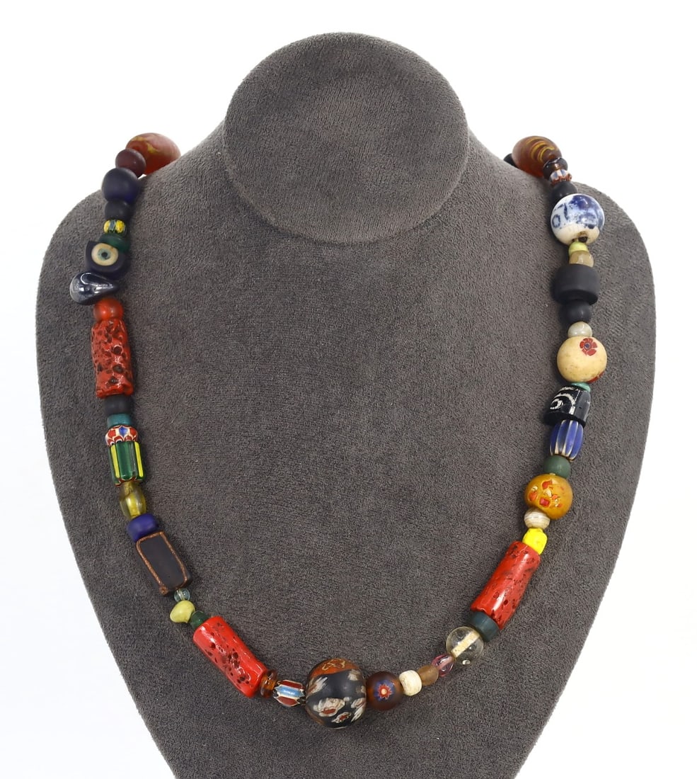 Antique Glass Bead Necklace with Millefiori, Chevron, and Murano Beads, Circa 19th-20th Century: Category: Beads and Jewelry Components Showcasing an exquisite assembly of Millefiori, Chevron, and Murano glass beads, this necklace illustrates the peak of Venetian glassmaking. The diverse patterns