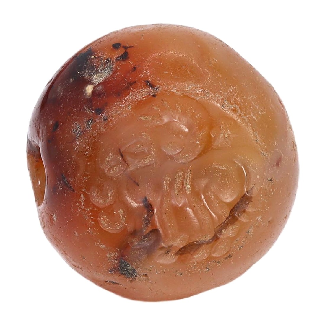 An Ancient Sasanian Carnelian Stamp Seal with Engraved Ibex, c. 3rd-7th Century CE: This hemispherical carnelian stamp seal from the Sasanian Empire, dating back to circa 3rd to 7th century CE, features an intricate engraving of an ibex. The detailed craftsmanship reflects the sophis