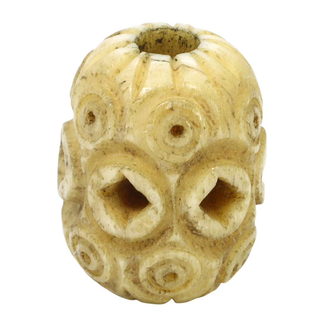 An Islamic Period Carved Bone Bead, c. 17th-18th Century CE: This intricately carved bead, made from bone, showcases the fine craftsmanship of the Islamic period, dating back to the 17th-18th century CE. The bead features detailed carvings that reflect the arti