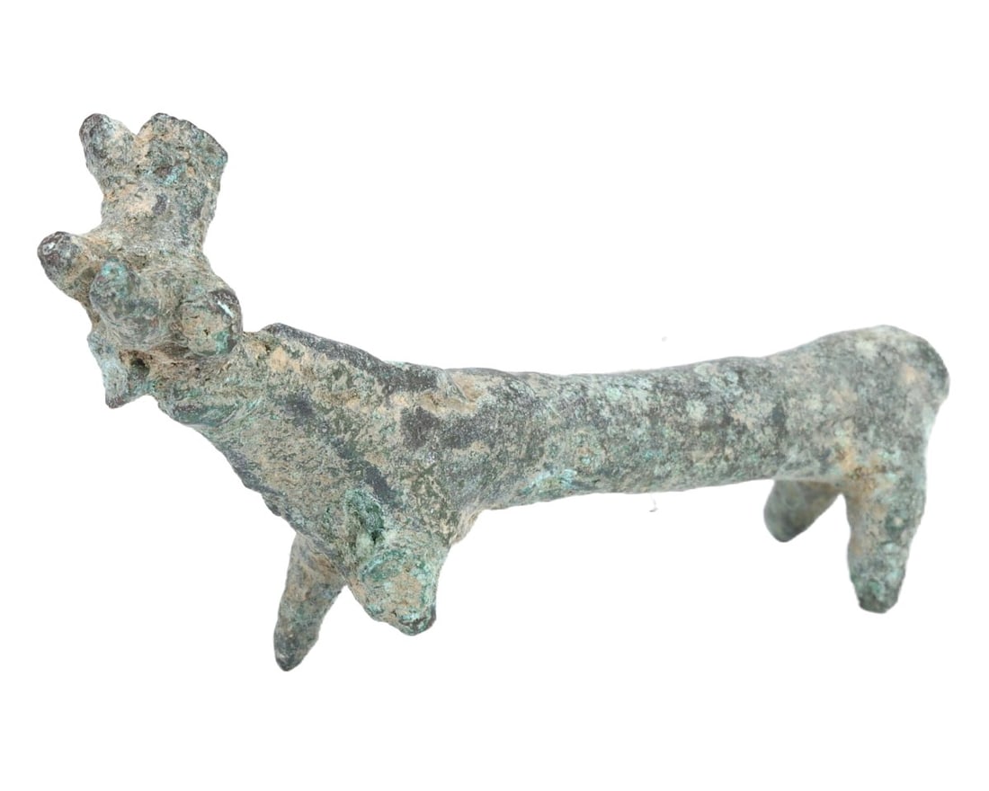 An Ancient Luristan Bronze Deer Figurine, c. 1st Millennium BCE: This bronze figurine of a deer from the Luristan culture, dating to the 1st millennium BCE, showcases the artistic representation and spiritual significance of animals in ancient Iranian societies. Th