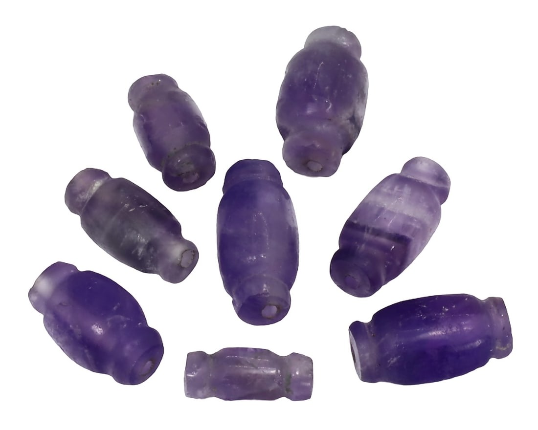 An Antique Mughal Empire Amethyst Collection of Beads, c. 1526-1857: This exquisite collection of oblate-shaped beads, made from purple, indigo, and cobalt amethyst. Dating back to the Mughal Empire (c. 1526-1857), it exemplifies the exceptional craftsmanship and intri