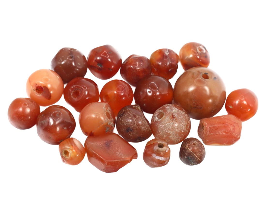 Collection of Antique Medieval Carnelian Beads, c. 1200-1500: This collection of mixed-shaped beads, made from caramelized, orange, and roycroft copper red carnelian. Dating back to the Medieval period (c. 1200-1500), it exemplifies the intricate craftsmanship a