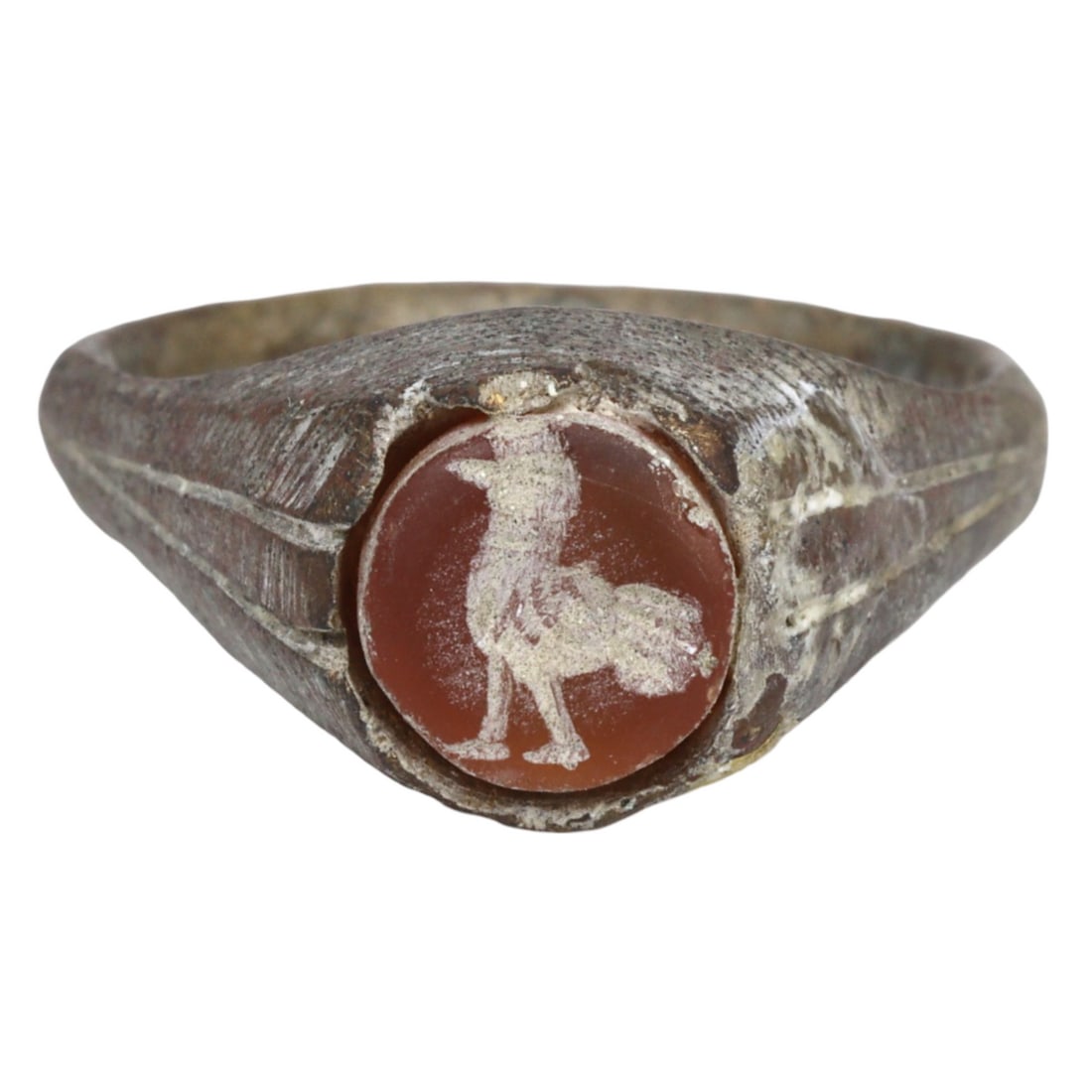 An Ancient Sasanian Carnelian Ring Bronze Heraldic Bird Stamp Seal Signet Ring, c. 224-651 CE: This heraldic bird stamp seal signet ring, made from verde marron, copper red carnelian ring bronze. Dating back to the Sasanian period (c. 224-651 CE), it exemplifies the exquisite craftsmanship and 