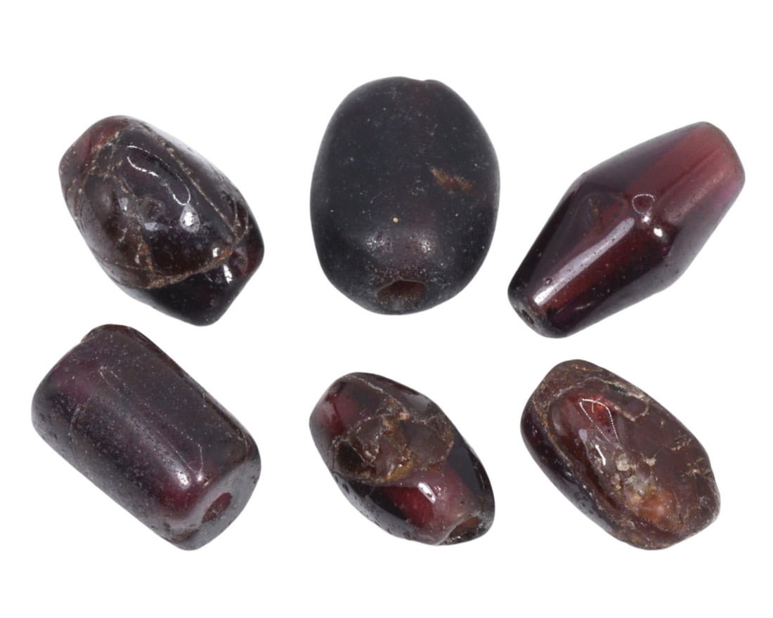 Auction Mixed Lot of Antique Medieval Garnet Beads, c. 1100-1500 Auction: This mixed lot of antique medieval beads, made from maroon garnet. Dating back to the Medieval period (c. 1100-1500), it exemplifies the intricate craftsmanship and the rich cultural heritage of Europ