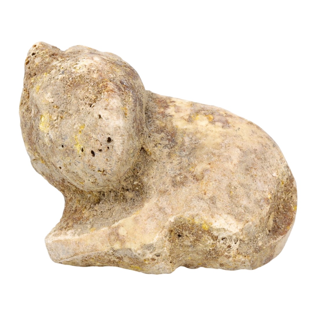 An Ancient Sumerian Bone Recumbent Bovid Figurine, c. 2500-2000 BCE: This intricately carved recumbent bovid figurine, made from bone, dates back to the Sumerian period (c. 2500-2000 BCE). It exemplifies the advanced craftsmanship and artistic expression of early Mesop