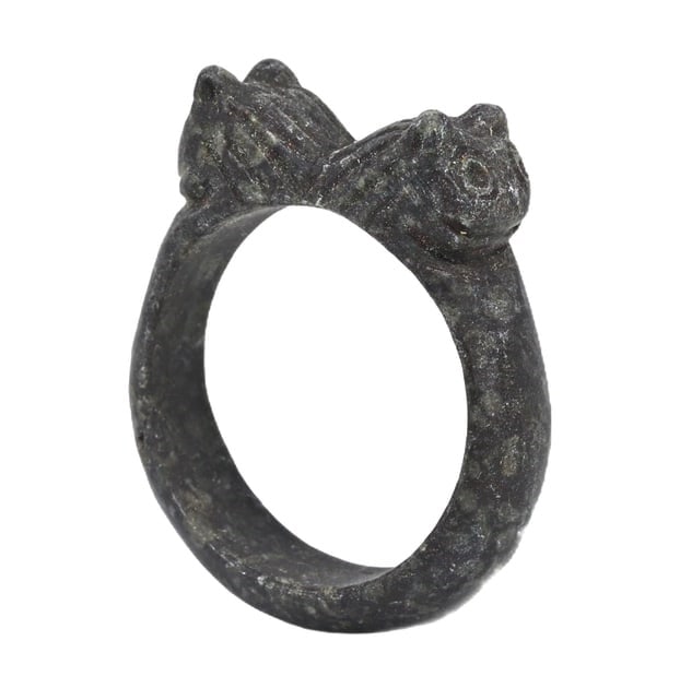 An Achaemenid Empire Steatite Carved Ring, c. 550-330 BCE: This exquisitely carved steatite ring originates from the Achaemenid Empire, demonstrating the sophisticated craftsmanship and artistic expression of the period. Steatite's durability made it a favore