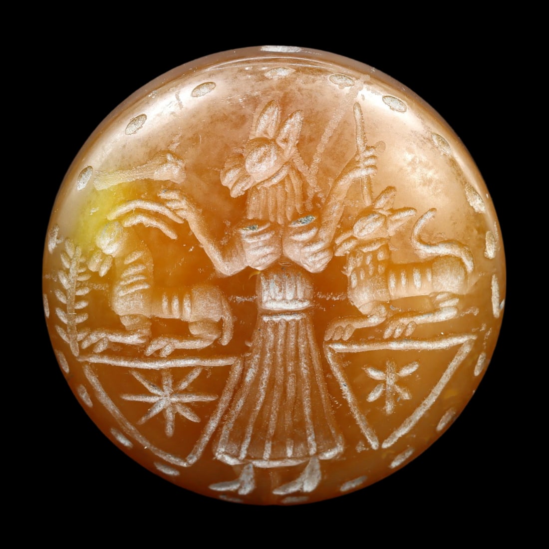An Antique Islamic Carnelian Double Convex Stamp Seal Bead, c. 9th-12th Century: This double convex stamp seal bead, made from carnelian, exemplifies the exquisite craftsmanship and intricate design characteristic of Islamic artifacts from the 9th to 12th centuries. Such seal bead