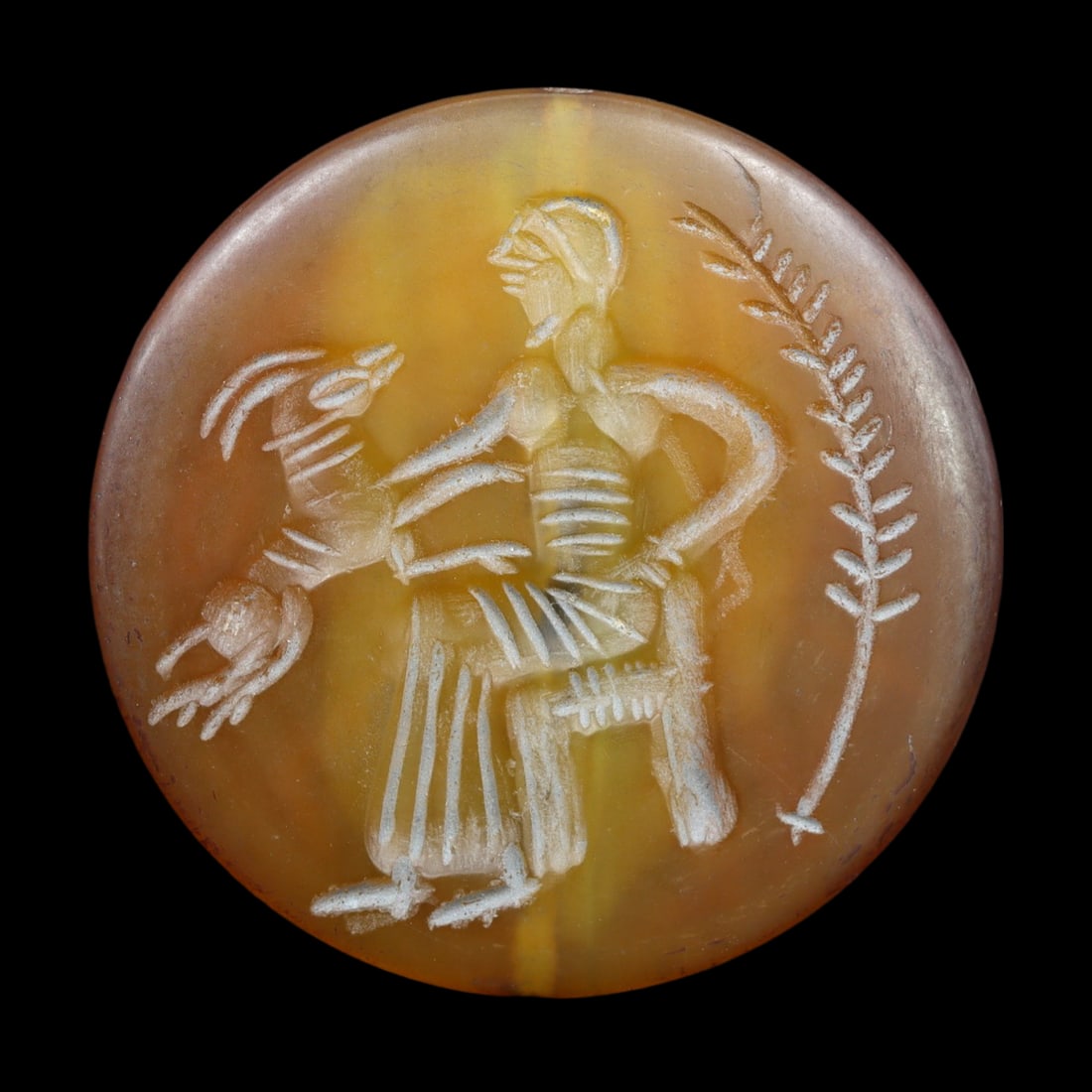 An Antique Islamic Carnelian Double Convex Stamp Seal Bead, c. 9th-12th Century: This double convex stamp seal bead, made from carnelian, exemplifies the exquisite craftsmanship and intricate design characteristic of Islamic artifacts from the 9th to 12th centuries. Such seal bead