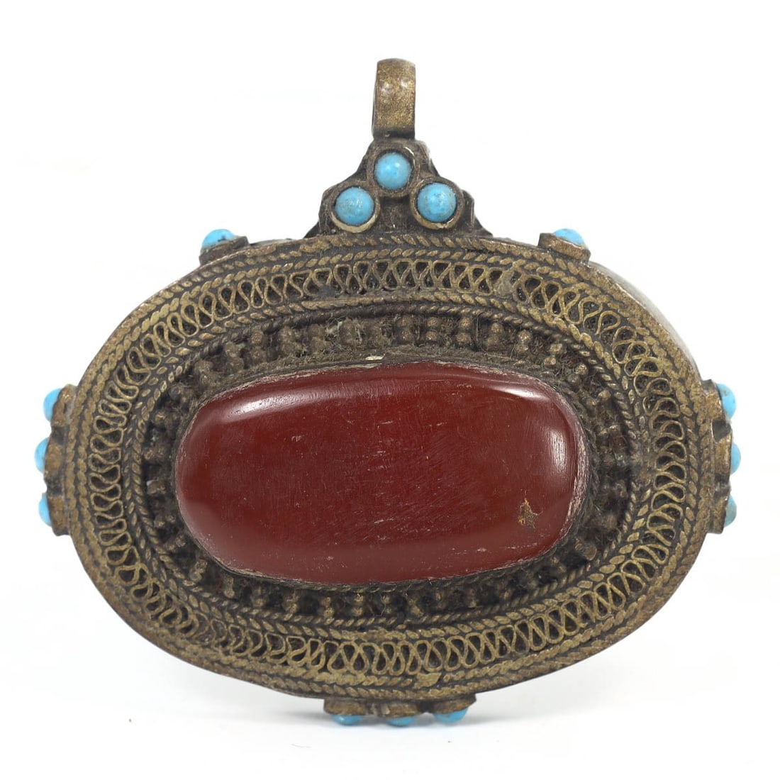 An Antique Ottoman Silver Carnelian and Turquoise Amulet Locket, c. 18th-19th Century: This intricate amulet locket, made from silver and adorned with carnelian and turquoise gemstones, dates back to the Ottoman period (c. 1700s). It exemplifies the exquisite craftsmanship and cultural 