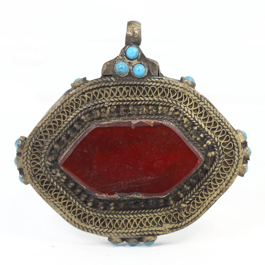 An Antique Carnelian, Turquoise, and Silver Amulet Locket, c. 18th - 19th Century: This exquisite amulet locket, made from carnelian, turquoise, and silver, dates back to the c. 18th - 19th Century. It exemplifies the intricate craftsmanship and rich cultural significance of Islamic