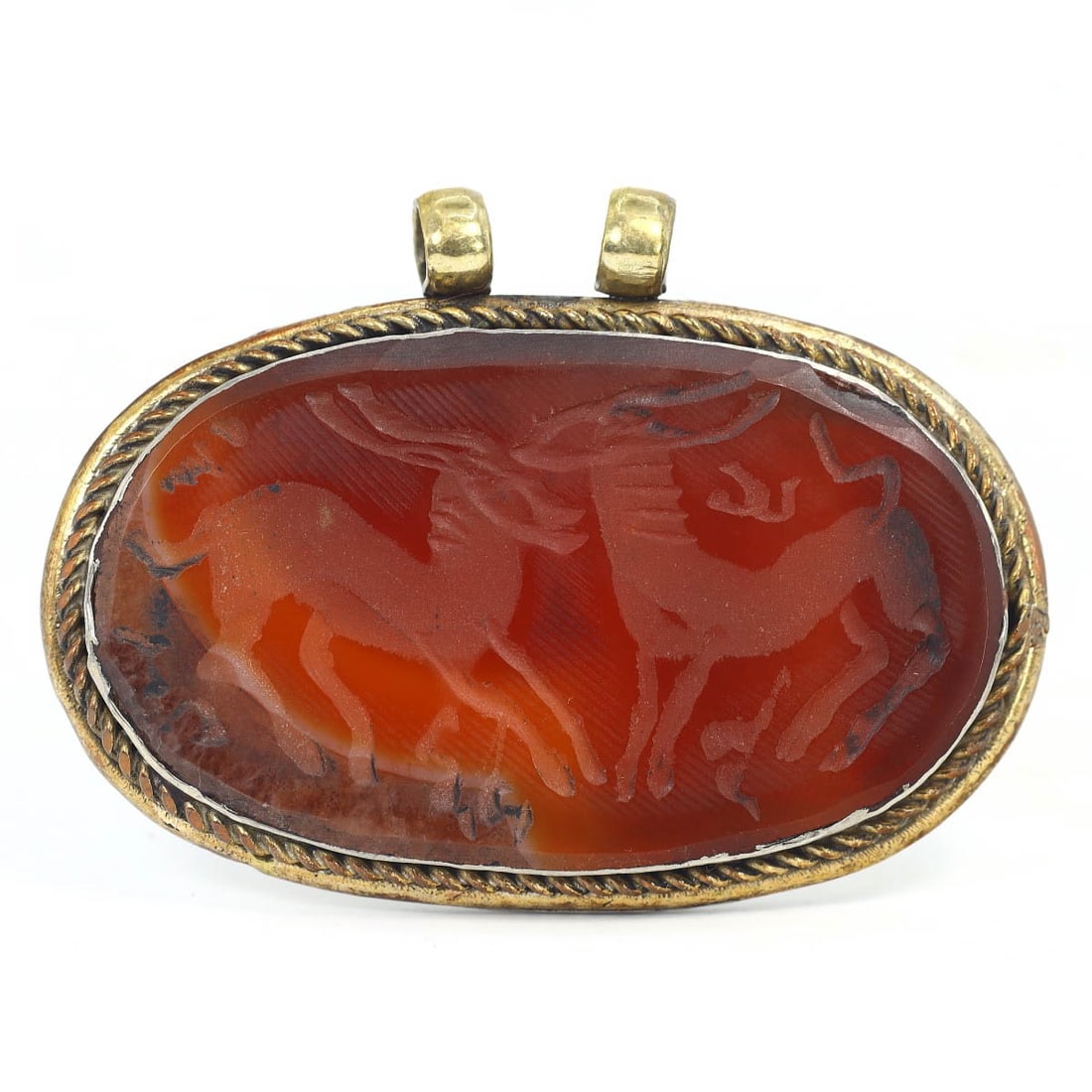 An Antique Sassanian Carnelian and Silver High Relief Zoomorphic Amulet Locket, c. 224-651 CE: This high relief zoomorphic amulet locket, made from carnelian and silver. Dating back to the Sassanian period (c. 224-651 CE), it exemplifies the exquisite craftsmanship and intricate design characte
