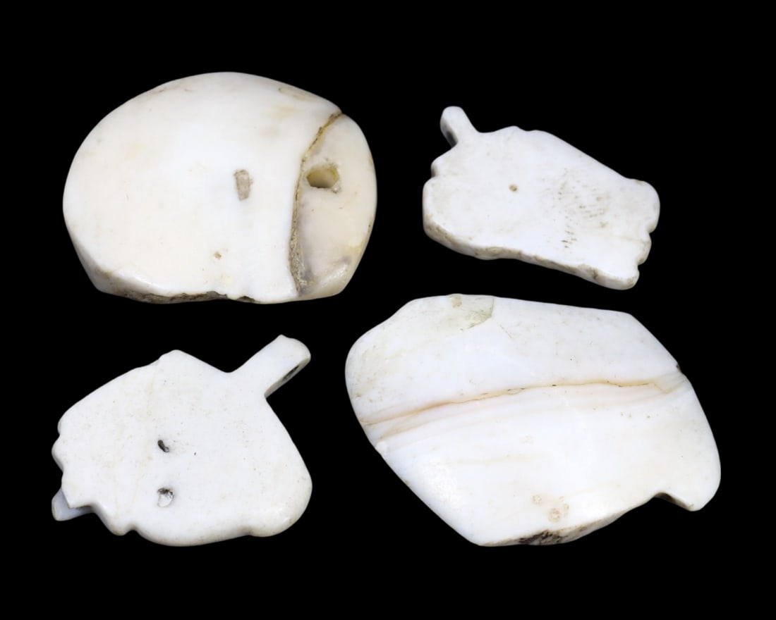 Collection of Ancient Sasanian Conch Shell Locket Amulets, c. 224-651 CE: This collection of four locket amulets, made from conch shell. Dating back to the Sasanian period (c. 224-651 CE), it exemplifies the intricate craftsmanship and rich cultural heritage of ancient Nish