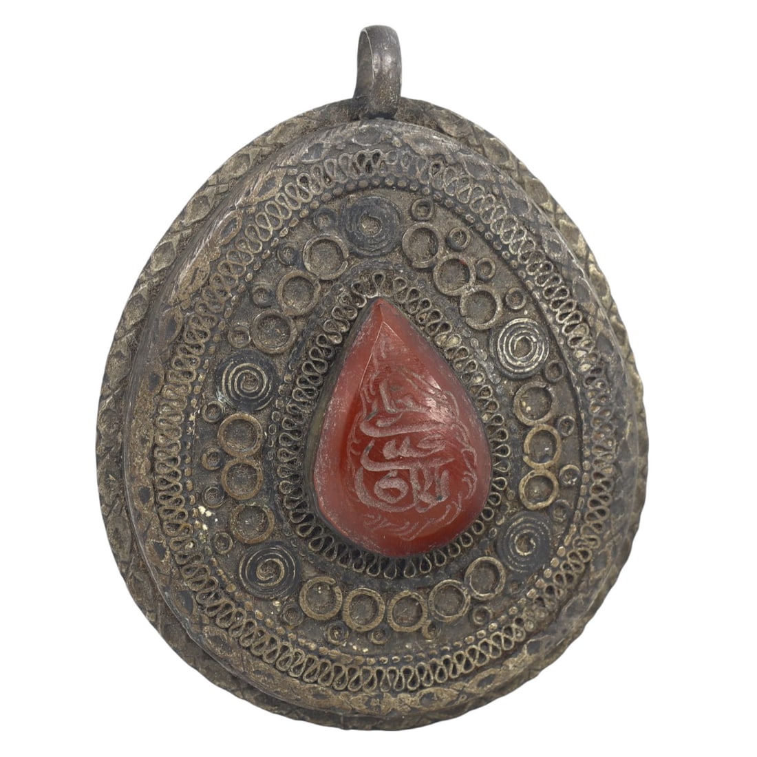 An Ancient Achaemenid Empire Steatite Carved Ring, c. 550-330 BCE: This round amulet locket, made from fine carnelian, it exemplifies the intricate craftsmanship and deep cultural significance of Islamic art from this era. The carnelian inscription at the middle of t