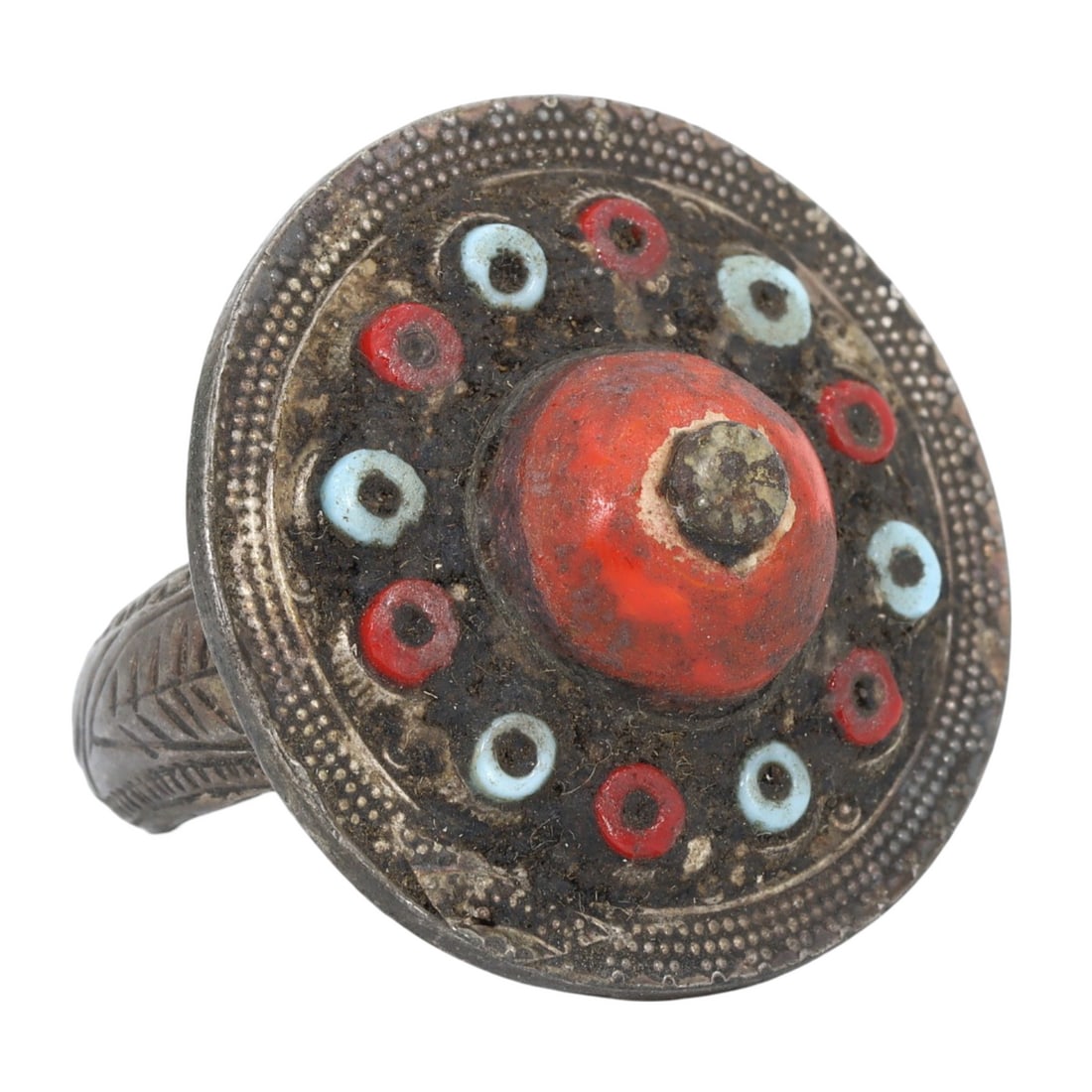 An Antique Mughal Gilt Silver Cocktail Ring: This stunning cocktail ring, made from gilt silver adorned with a vibrant colored stone. This ring exemplifies the exquisite craftsmanship and opulent design characteristic of the Mughal period. Such 
