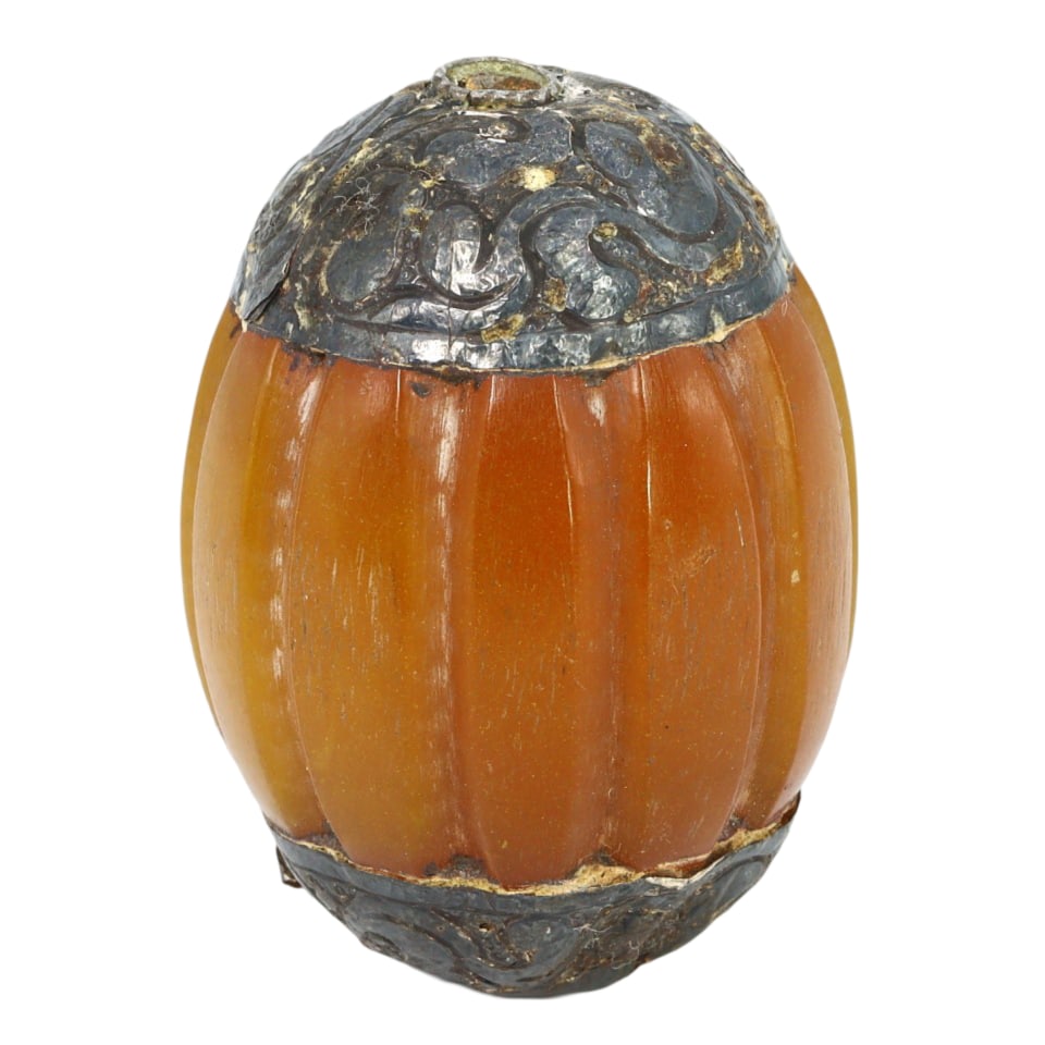 An Vintage 19th Century Pressed Amber and Gilt Silver Prayer Bead, c. 1800-1899: This exquisite pressed amber prayer bead, made from pressed amber and gilt silver. This prayer bead exemplifies the intricate craftsmanship and spiritual significance of Himalayan Tibetan culture. Suc