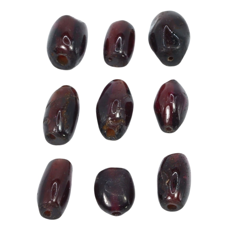 Group of Antique Renaissance Garnet Carved Beads: This exquisite group of 9 carved beads, made from rich garnet. These beads exemplify the intricate craftsmanship and artistic excellence of the Renaissance period in Europe. Such beads were commonly u