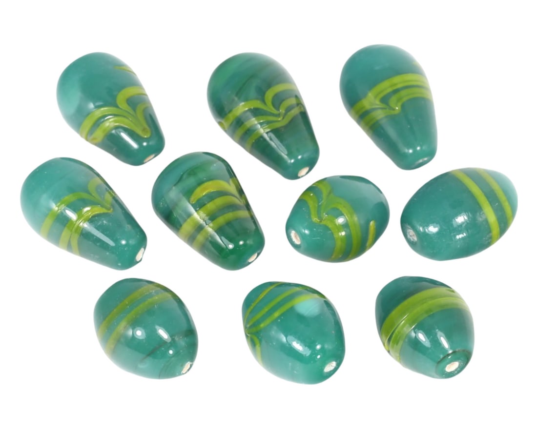 Collection of Old Renaissance Wound Glass Beads: This collection of 10 monochrome beads with linear patterns, made from wound glass. These beads exemplify the exquisite craftsmanship and artistic techniques of the Renaissance period in Murano, Venic