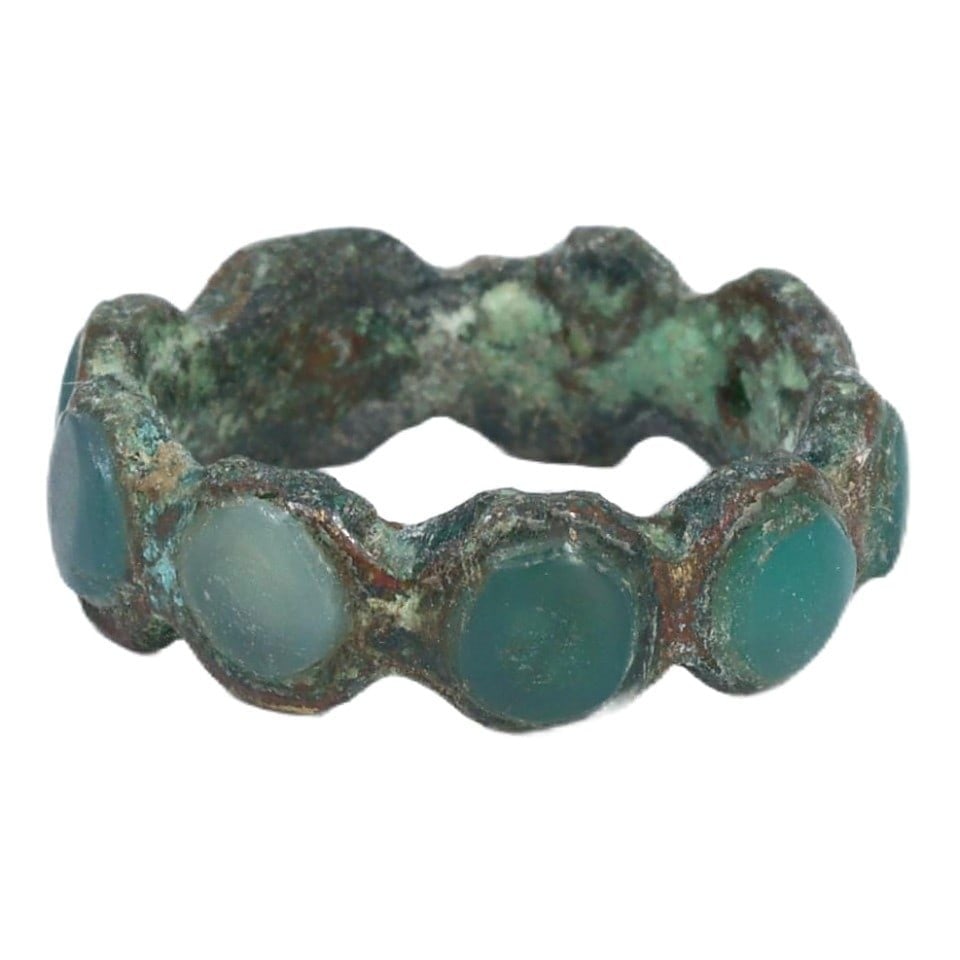 Ancient Sasanian Chalcedony and Bronze Ring, c. 224-651 CE: This ring from the Sasanian Empire is crafted from bronze and set with chalcedony, a gemstone valued for its protective qualities and aesthetic appeal. The incorporation of chalcedony into Sasanian je