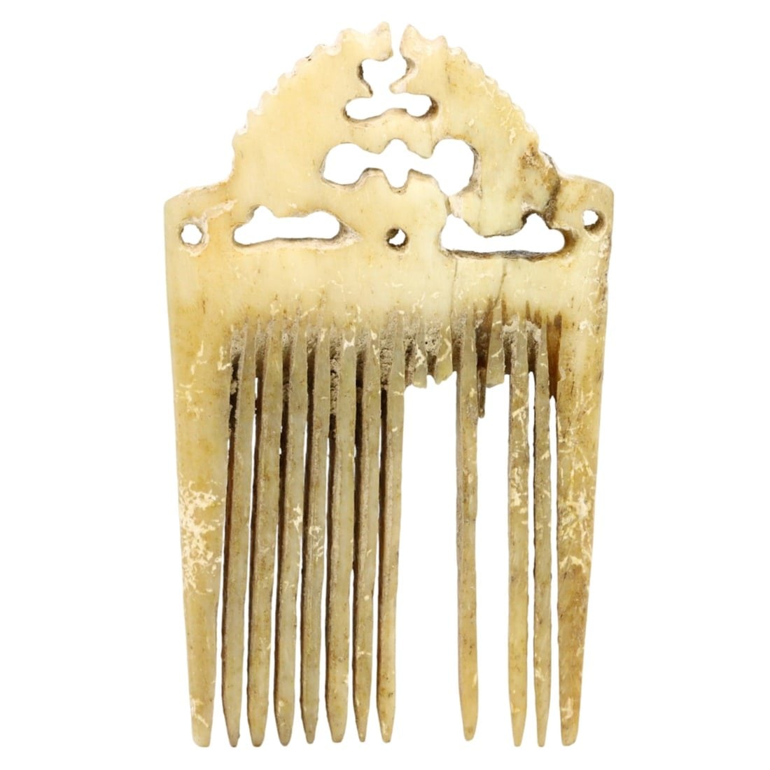 An Ancient Byzantine Whale Bone Comb, c. 500-1453 AD: This exquisite comb, made from gold and beige whale bone. Dating back to the Byzantine period (c. 500-1453 AD), it exemplifies the intricate craftsmanship and cultural significance of the era. Such co