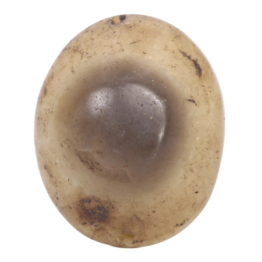 An Antique 19th Century Agate Luk Mik Goat Eye, c. 1800-1899: This Luk Mik Goat Eye, made from agate, dates back to the 19th Century (c. 1800-1899). It exemplifies the intricate craftsmanship and deep cultural significance of Tibetan artisanship. Such objects we