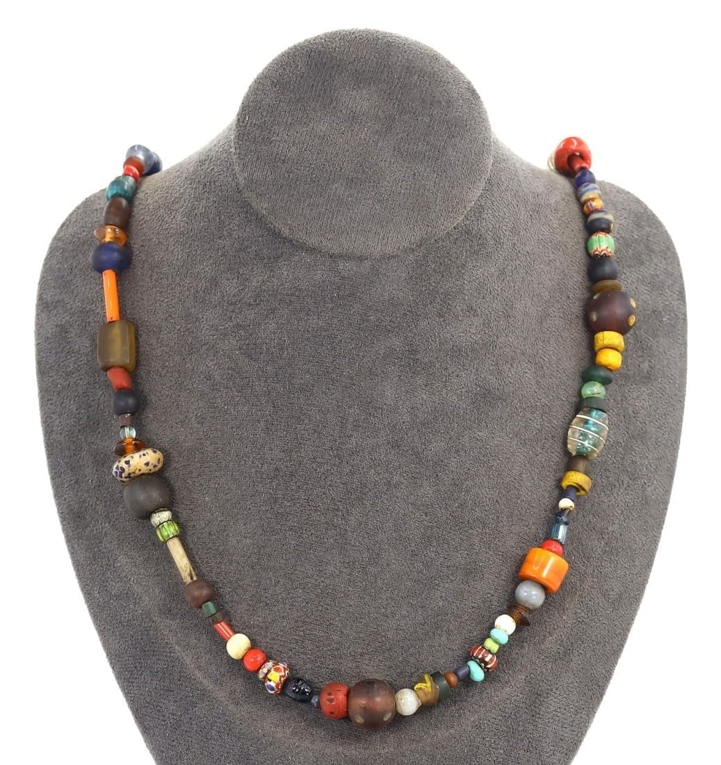 Antique Glass Bead Necklace with Millefiori, Chevron, and Murano Beads, Circa 19th-20th Century: This eclectic antique glass bead necklace combines the artistry of Millefiori, Chevron, and Murano beads. Reflecting the rich glassmaking traditions of Venice from the 19th to 20th century, this neckl