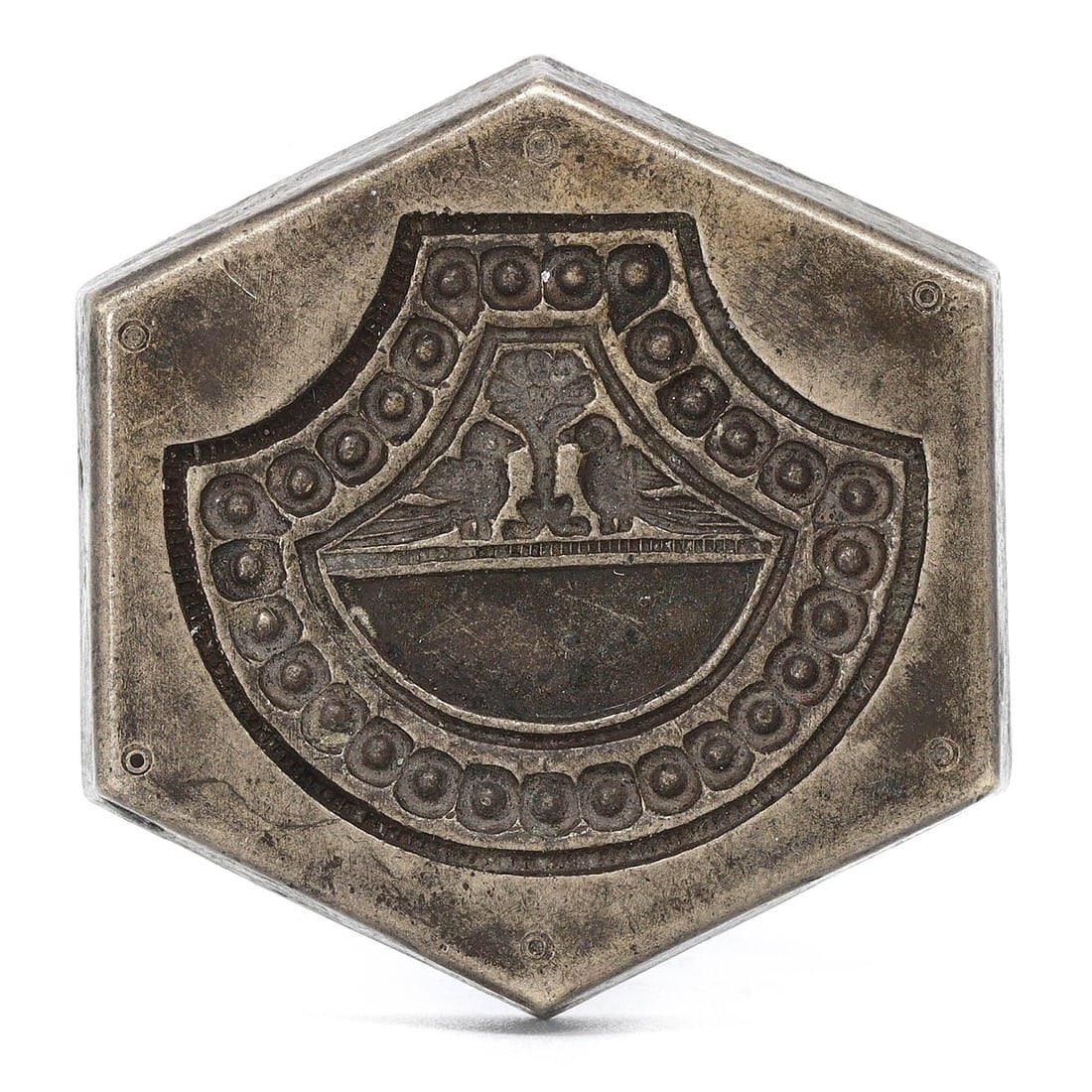 An Ancient Byzantine Bronze Hexagonal Weight with Monograms, Circa 6th-7th Century: A substantial and ornate Byzantine bronze hexagonal weight, measuring 3.5 x 0.7 cm. The intricate monograms and symbols on its surface likely identify the weight's value and may refer to the issuing a