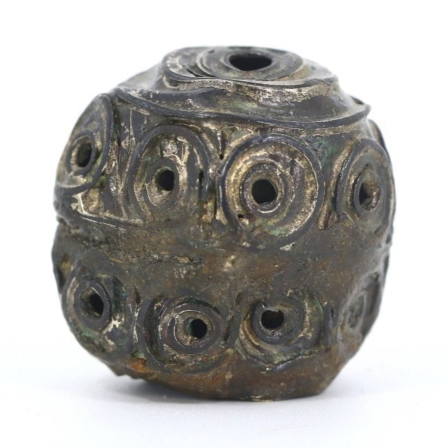 An Ancient Seljuk Era Silver Floral Engraved Bead, 11th-12th Century AD: This exquisite 2.4 x 2.2 cm bead hails from the highpoint of the Seljuk Empire, showcasing an intricate floral engraving that reflects the era's artistic sensibilities and the symbolic importance of n