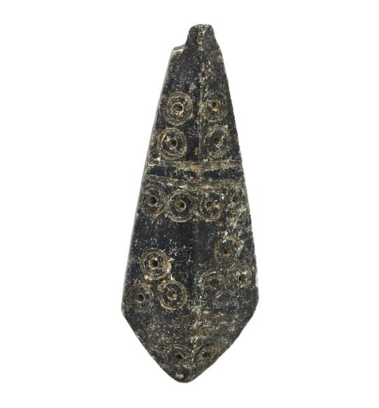 An Ancient Steatite Amulet with Dot Eye Carving, Akkadian Empire, c. 2334-2154 BCE: This steatite amulet from the Akkadian Empire features a dot eye carving, a motif often used to ward off the evil eye and protect the wearer. The use of steatite and the stylized eye symbol are indica