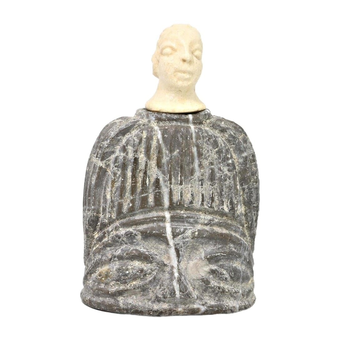 An Ancient Bactria-Margiana Steatite and Limestone Idol, c. 2300-1700 BCE: Category: Figurines and Statuettes This idol from the Bactria-Margiana Archaeological Complex, crafted in steatite with a limestone head, dates back to circa 2300-1700 BCE. The combination of material