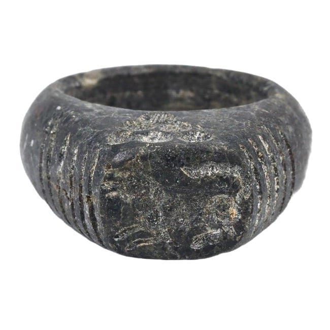 An Ancient Achaemenid Empire Steatite Carved Ring, c. 550-330 BCE: This exquisitely carved steatite ring originates from the Achaemenid Empire, demonstrating the sophisticated craftsmanship and artistic expression of the period. Steatite's durability made it a favore