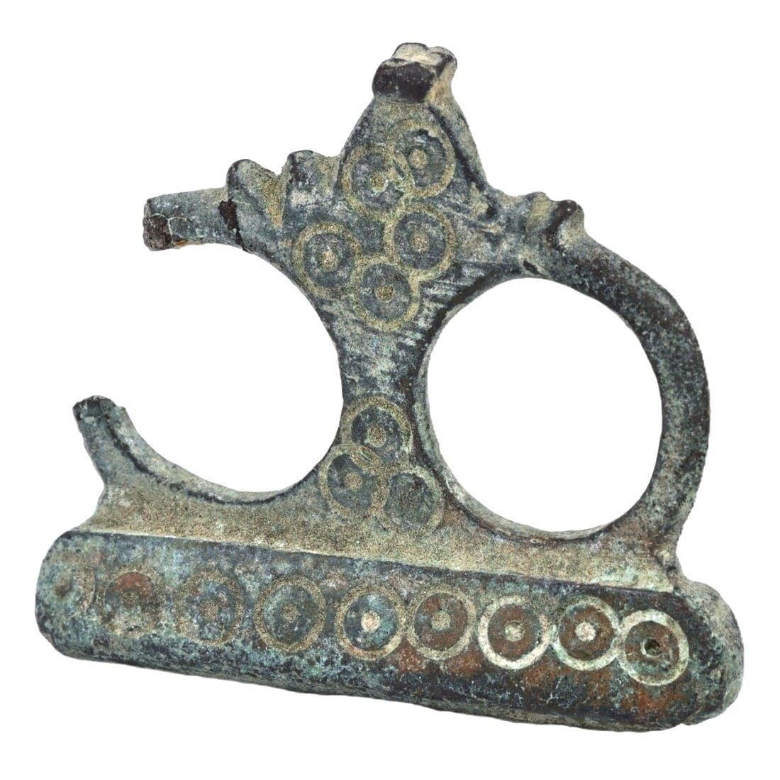 An Ancient Byzantine Bronze Shaver Handle, ca. 4th-6th Century CE: Category: Decorative Furniture Elements This piece, characterized by its ornamental design with a dot motif, suggests its use in Byzantine grooming rituals. The integration of functional and decorativ