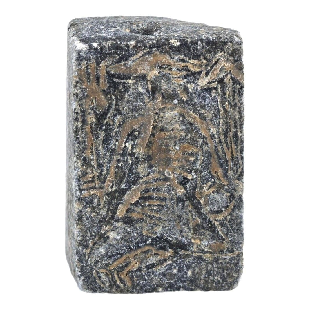 An Ancient Near Eastern Steatite Two-Faced Stamp Seal, Neo-Babylonian Period, c. 626-539 BCE: Originating from the Neo-Babylonian Period, this steatite seal features distinct carvings on both faces. Such seals were essential tools in ancient Mesopotamian bureaucracy, used for authenticating do