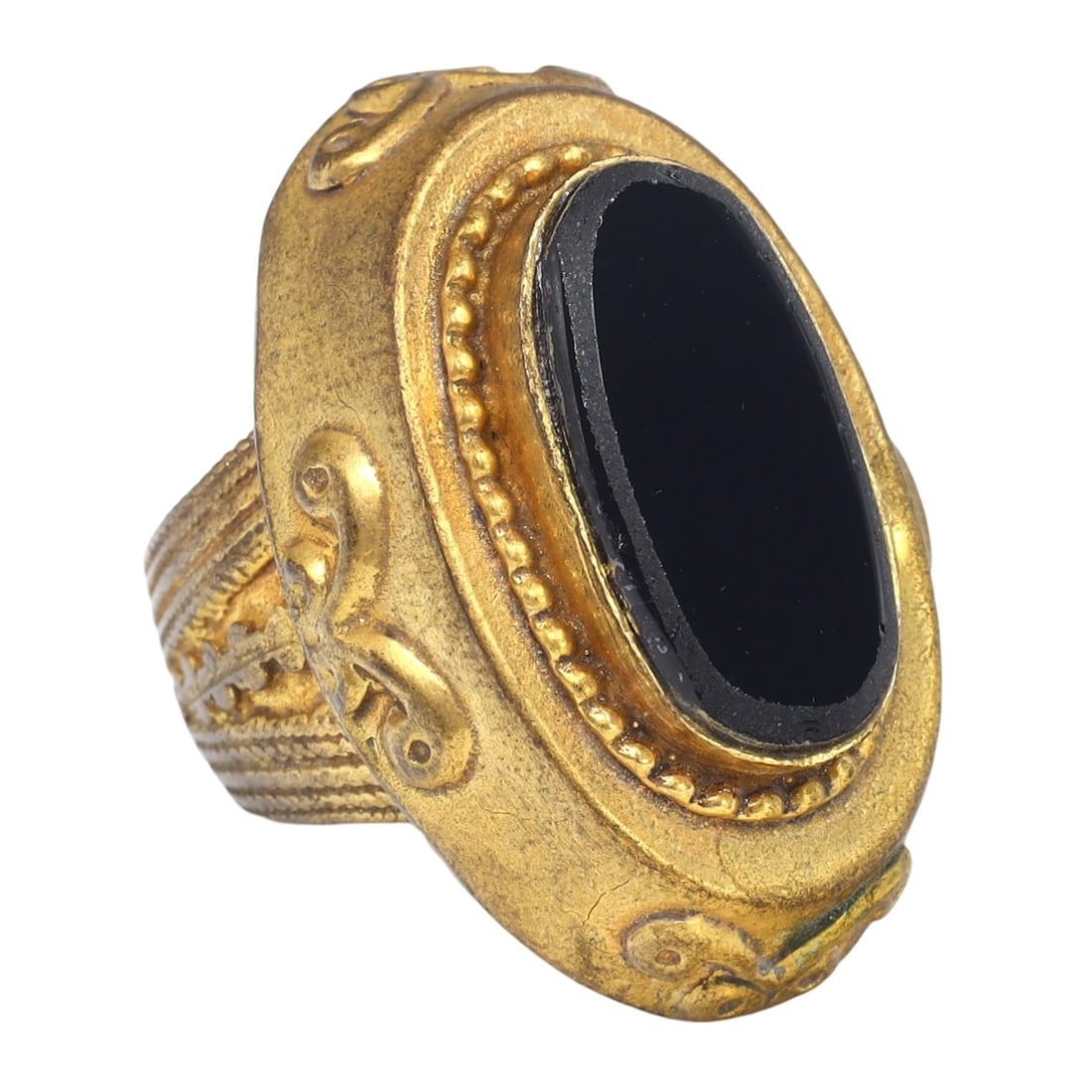 An Antique Ottoman Onyx Gilt Silver Cocktail Ring: This exquisite cocktail ring, made from onyx and gilt silver. This ring exemplifies the intricate craftsmanship and luxurious design characteristic of the Ottoman Empire. Such rings were commonly used