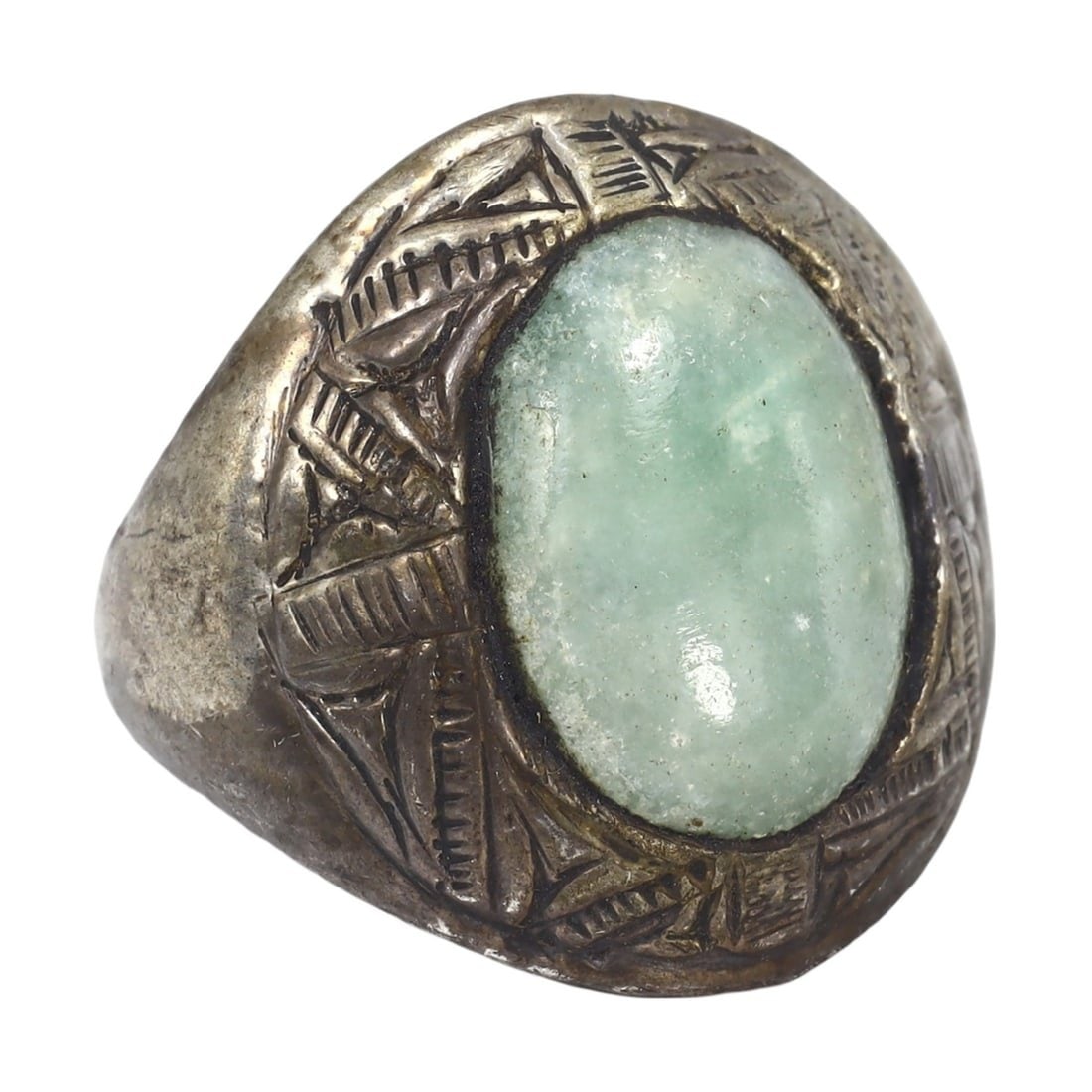 An Antique Ottoman Nephrite and Gilt Silver Cocktail Ring: This exquisite cocktail ring, made from nephrite and gilt silver, exemplifies the refined craftsmanship and rich cultural heritage of the Ottoman period. This ring showcases intricate designs and meti