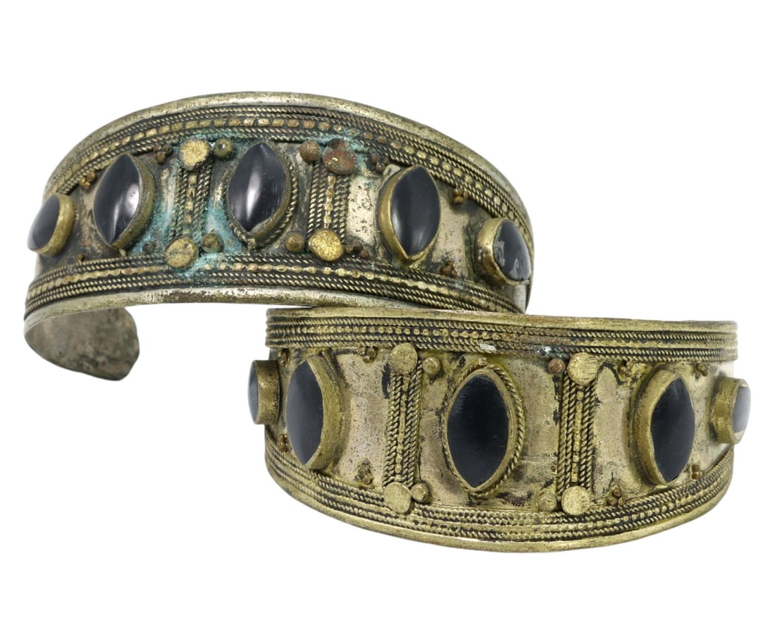 Traditional Tribal Middle Eastern Onyx Alloy Cuff Bracelets: This exquisite pair of metal alloy cuff bracelets, adorned with striking black onyx stones, exemplifies the intricate craftsmanship and rich cultural significance of traditional Middle Eastern tribal