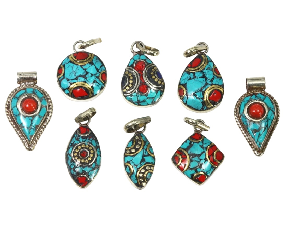 Himalayan Traditional Himalayan Silver Lockets Pendants Set: This Silver Lockets Pendants Set exemplifies the intricate craftsmanship and cultural significance of Himalayan traditional jewelry. The set includes multiple lockets and pendants, each featuring vibr