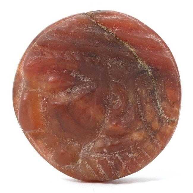 An Ancient Sasanian Carved Carnelian Seal, Circa 3rd-7th Century CE: This finely carved carnelian seal bears the stylistic traits of Sasanian art, which flourished from the 3rd to the 7th century CE. The Sasanian Empire is known for its intricate glyptic art, with seal