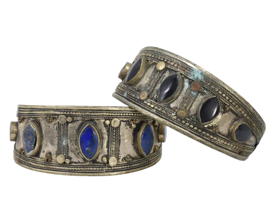 Traditional Tribal Middle Eastern Ethnic Lapis Lazuli Alloy Bracelets: This exquisite pair of lapis lazuli and metal alloy cuff bracelets exemplifies the intricate craftsmanship and rich cultural significance of traditional tribal Middle Eastern jewelry. Adorned with met