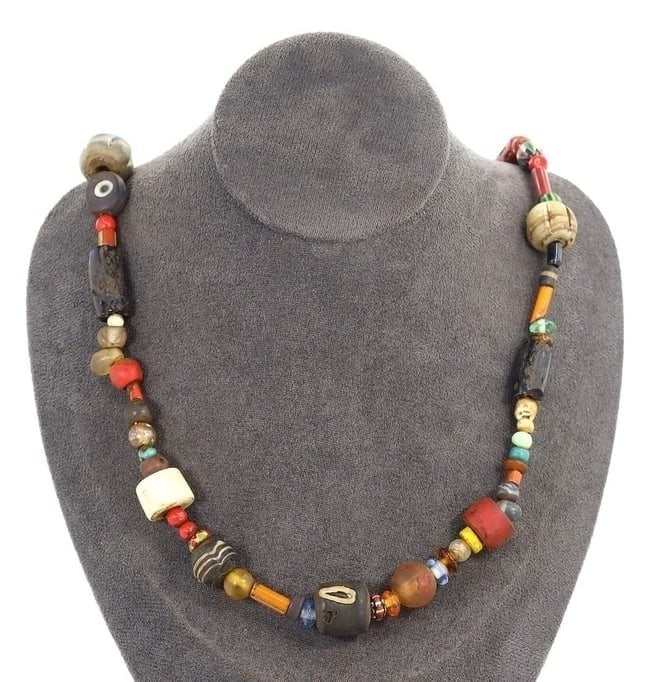 Antique Art Venetian Trade Beads Glass Beaded Necklace: This exquisite glass beaded necklace exemplifies the intricate craftsmanship and rich cultural significance of Venetian trade beads. With a mesmerizing mix of ancient beads, antique beads, African tra