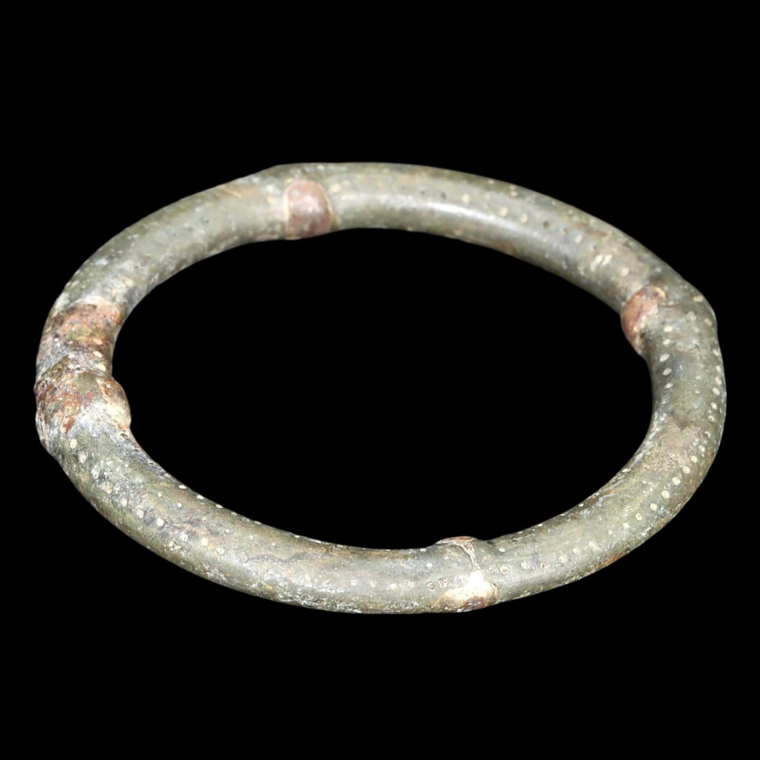 Ancient Medieval Viking Anglo-Saxon Bronze Bridle Ring or Currency, 10th-11th Century: This artifact, dating from the 10th to 11th century, serves as a bronze bridle ring or potentially as currency, embodying the craftsmanship and cultural interchange of Medieval Viking and Anglo-Saxon 