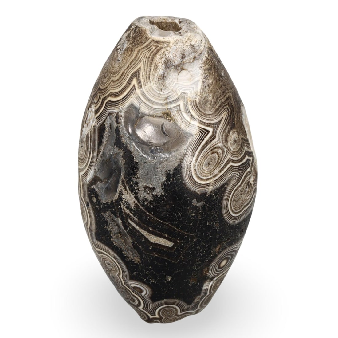 Ancient Sino-Himalayan Bicone Agate dZi Bead, 4th-8th Century: This Ancient Sino-Himalayan bicone dZi bead, crafted from agate, dates from the 4th to 8th centuries. dZi beads were highly valued in the Sino-Himalayan region for their believed protective and spirit