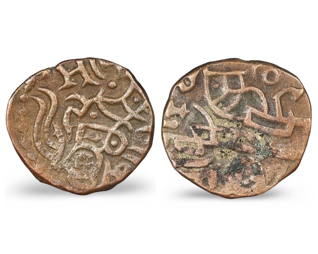 Ancient Medieval Chauhan of Delhi Dynasty Billon Coin, 1179 - 1194 CE: Dating from 1179 to 1194 CE during the Chauhan of Delhi Dynasty in South Asia, this billon coin features a bull on the obverse and Samanta Deva on horseback on the reverse. Weighing 3.638g and measuri