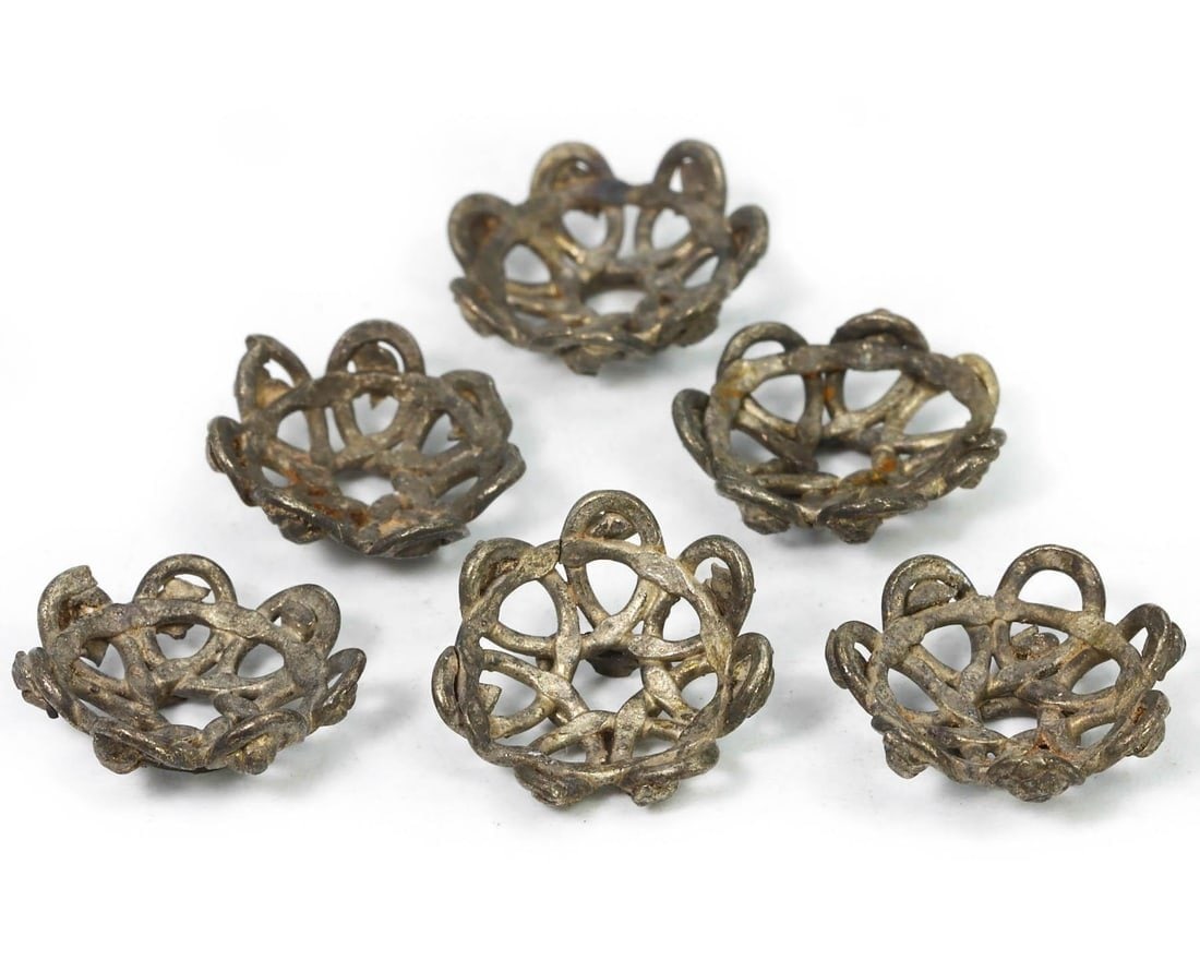 Lot of 6 Medieval Viking Silver Jewelry Filigree Bead End Caps, 10th-11th Century: This lot consists of six medieval Viking silver jewelry filigree bead end caps, dating back to the 10th-11th century. Each piece showcases the intricate craftsmanship characteristic of Viking metalwor