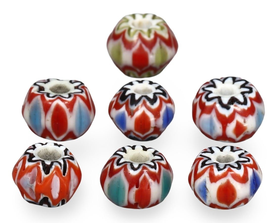 Lot of 7 Post Medieval Venetian Six-Layered Chevron Beads, 19th-20th Century: This lot comprises a collection of exquisite Venetian chevron beads, dating from the 19th to the 20th century. Each bead features a distinctive six-layered design, showcasing the vibrant colors and in