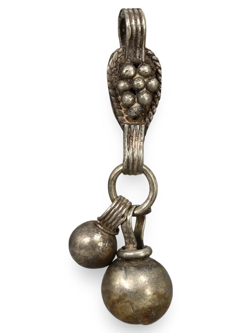 Ancient Medieval Viking / Celtic Silver Pendant Ornament, 9th-11th Century: This silver pendant ornament from the Ancient Medieval period, dating back to the 9th-11th century, is a remarkable example of Viking and Celtic craftsmanship. Such pendants were often used as amulets