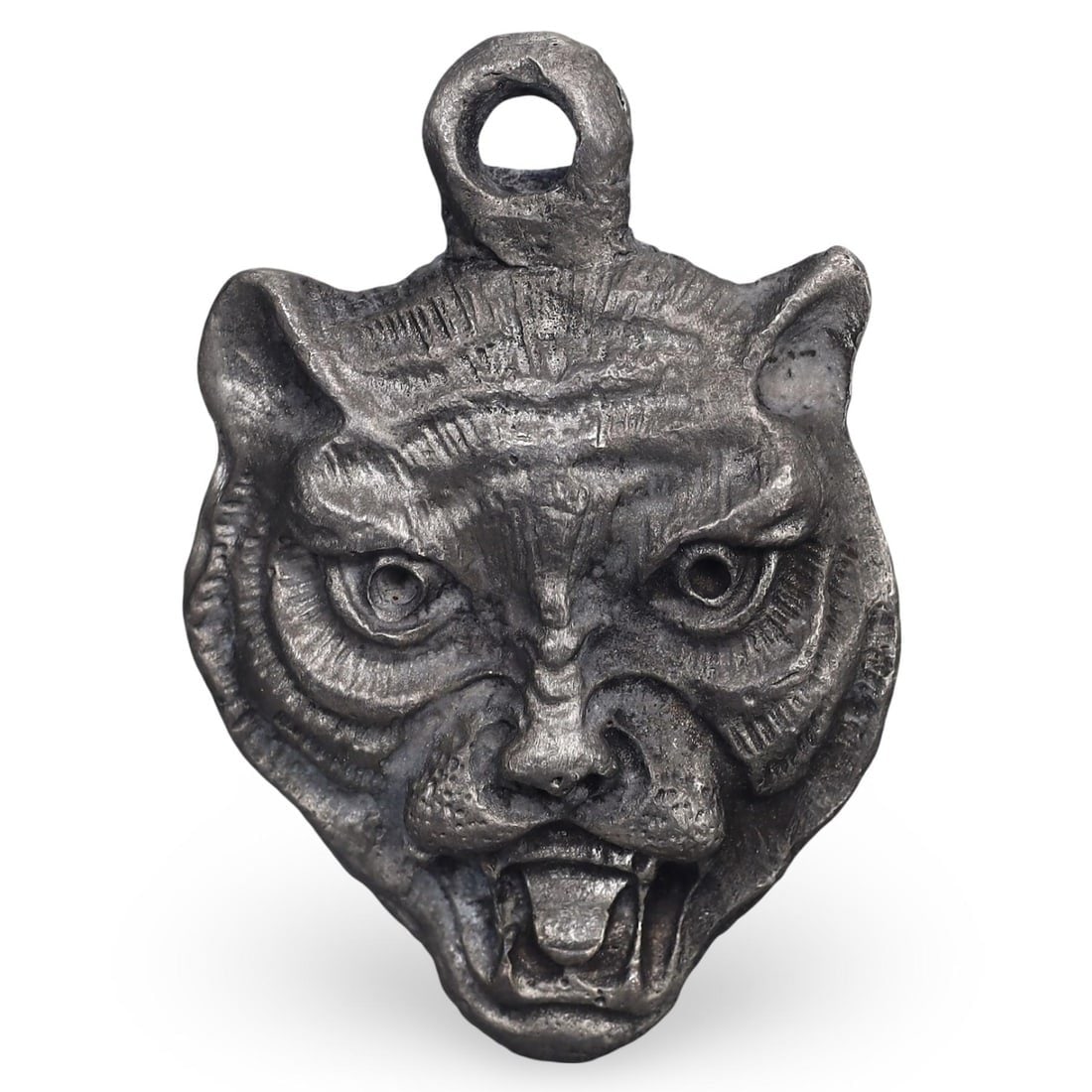 Post Medieval Sino-Tibetan Lead Tiger Amulet, 18th-19th Century: This Post Medieval tiger amulet from the Sino-Tibetan region, dating back to the 18th-19th century, is crafted from lead. The amulet features a detailed representation of a tiger, symbolizing strength