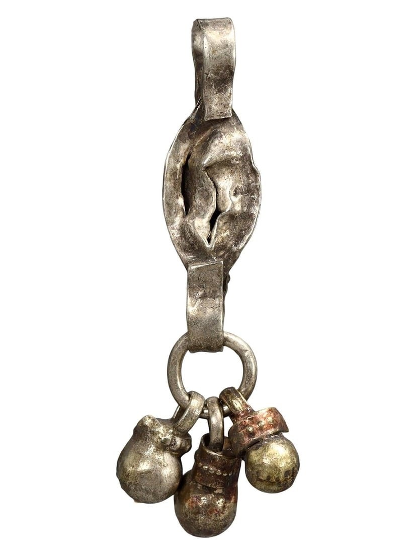 Ancient Medieval Viking / Celtic Silver Pendant Ornament, 9th-11th Century: This silver pendant ornament from the Ancient Medieval period, dating back to the 9th-11th century, is a remarkable example of Viking and Celtic craftsmanship. Such pendants were often used as amulets