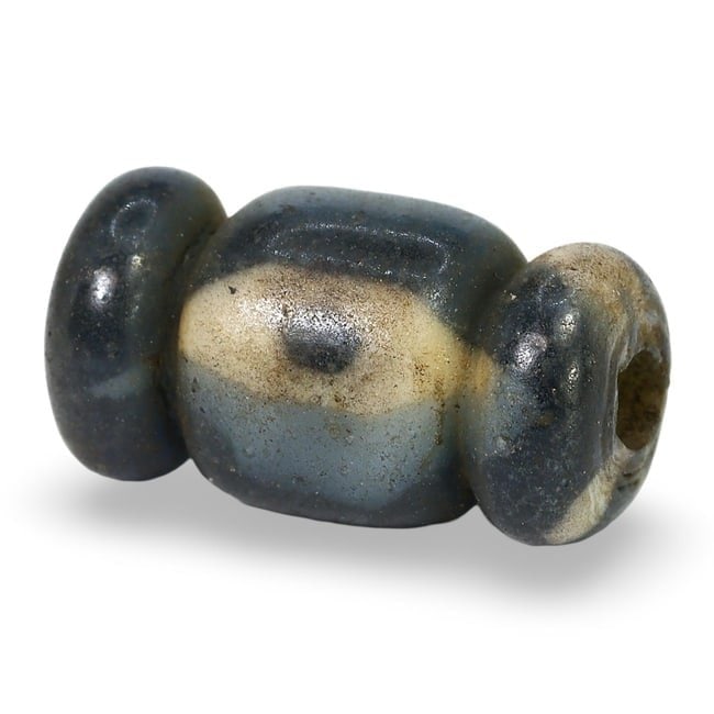 Ancient Late Medieval Silk Road Collared Eye Glass Bead, 12th-15th Century: This ancient glass bead from the Late Medieval period (12th-15th century) features a distinctive collared eye design. The bead showcases intricate glasswork with prominent collars and an eye-like cent