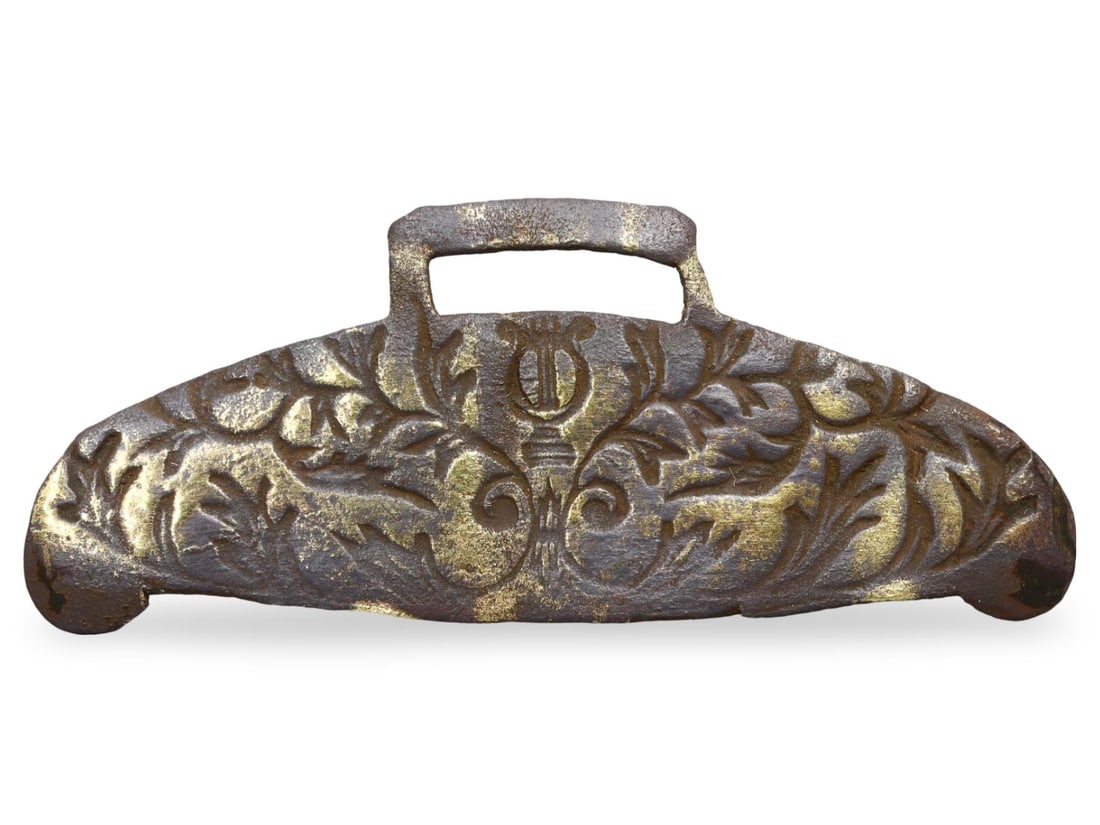 Ancient Middle Medieval Bronze Decorative Applique, 11th-13th Century: This exquisite piece is an ancient Middle Medieval bronze decorative applique, dating back to the 11th-13th century. It features intricate floral motifs and a central lyre design. The front of the app